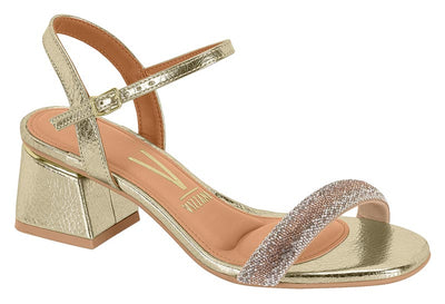 Gold sandal with glittery strap on a white background