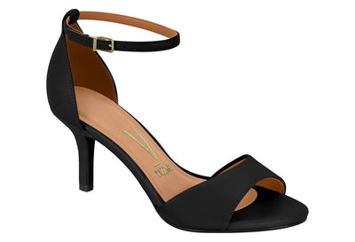 Black sandal with a tan insole on a white background