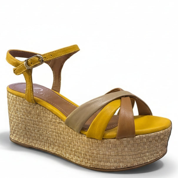 Yellow and brown wedge sandal on a white background