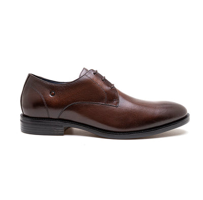 Brown leather dress shoe on a white background