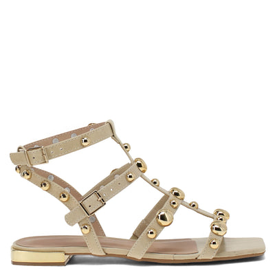 Beige sandal with gold straps and embellishments on a white background