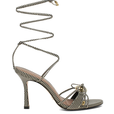 Zebra-striped high-heeled sandal with a chain detail on a white background