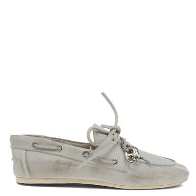 White boat shoe with decorative laces on a white background